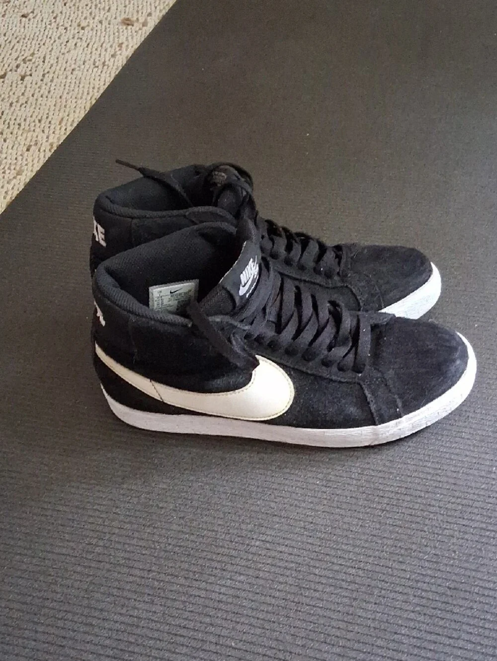Nike Black Mid-Top Sneakers with White Swoosh